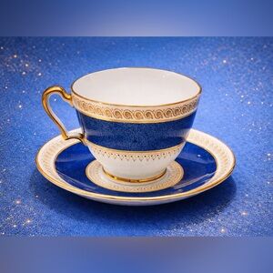 Elegant Blue and Gold Teacup and Saucer Set
Shaffordshire england bone china